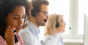 Three people working in a call center setting